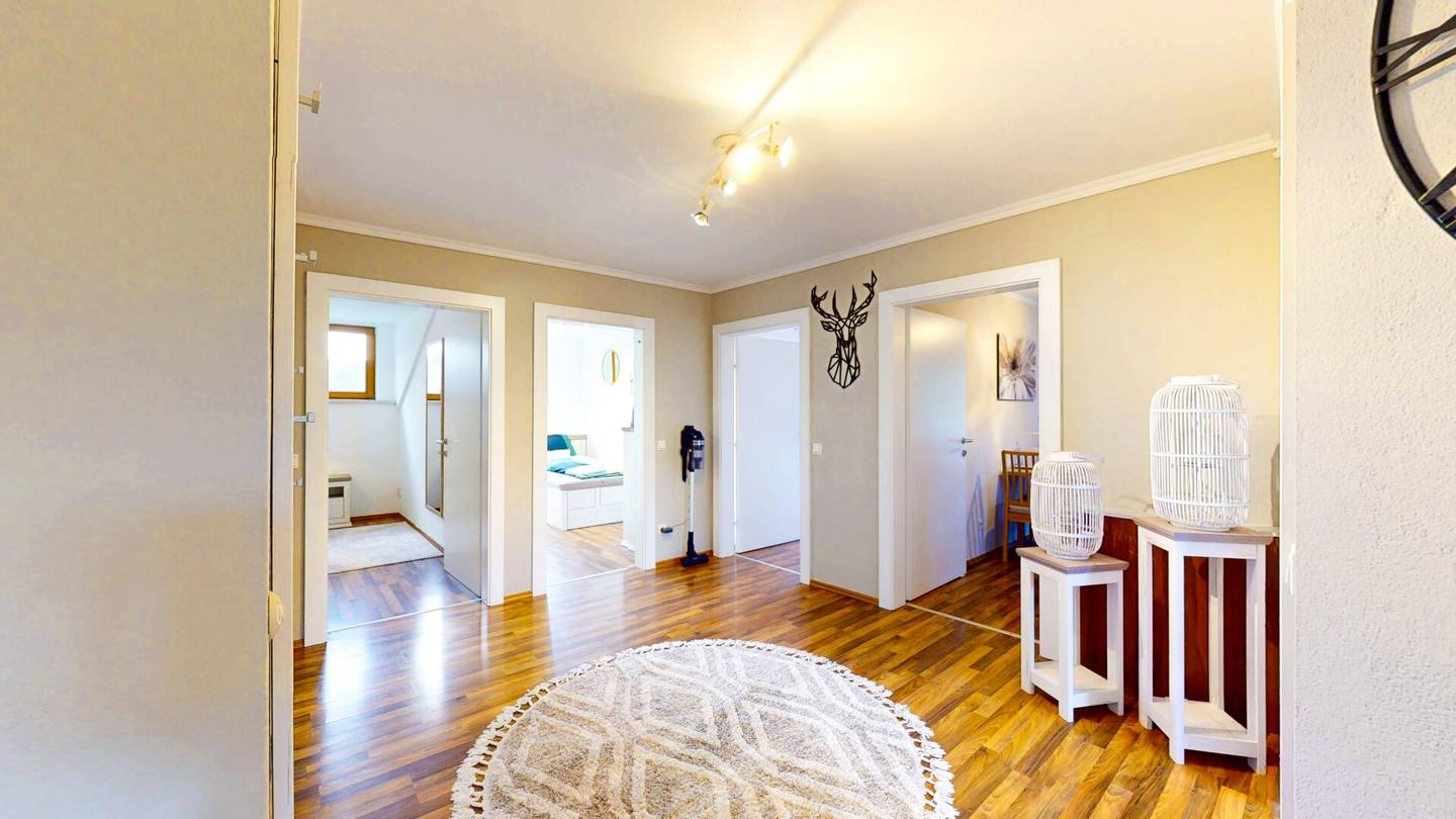 Holiday apartment with sunny balcony and parquet flooring in peaceful natural setting