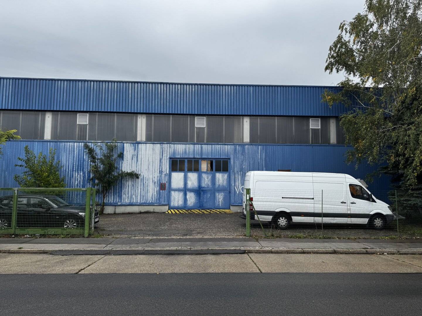 Modern warehouse with ground level truck access and parking spaces