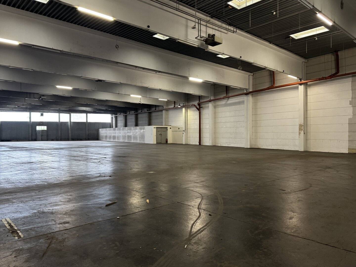 Modern warehouse with ground level truck access and parking spaces