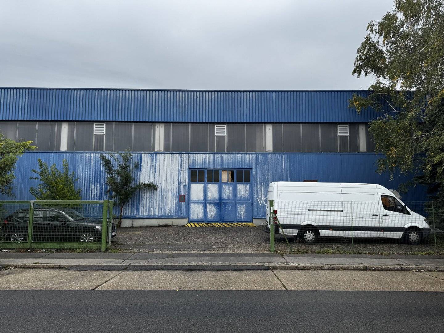 Modern warehouse with ground level truck access and parking spaces