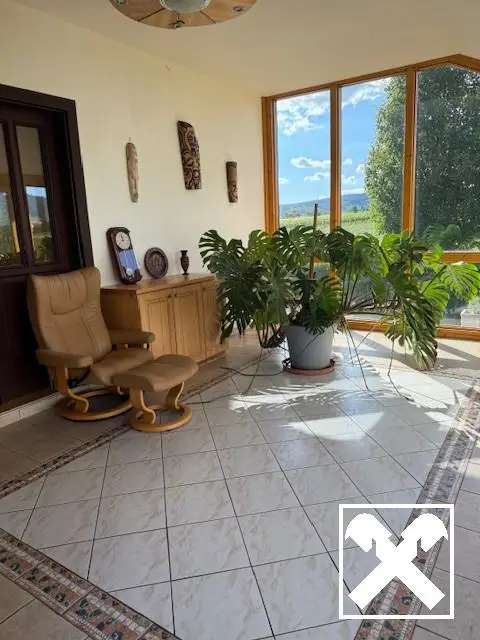 Family house with winter garden on large plot
