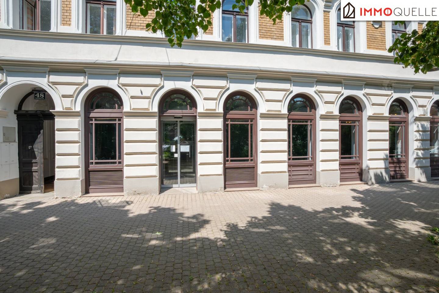 Modernized commercial space with open hall and basement storage