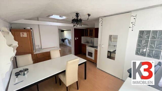 Two-family house with garden and garage in a quiet location