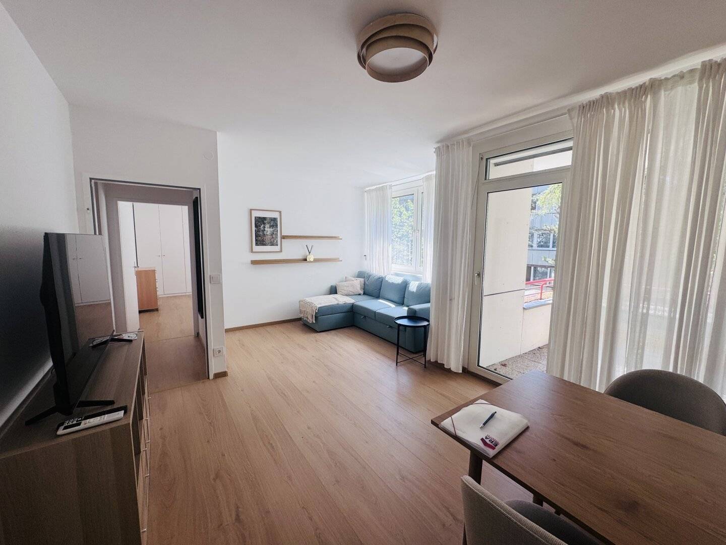 Bright 2-room new build apartment with terrace and parking in a quiet green location