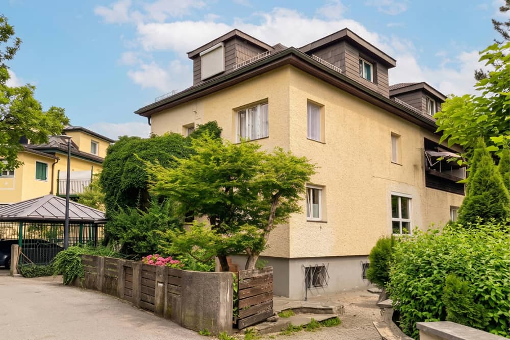 Multi family house with three units in green surroundings