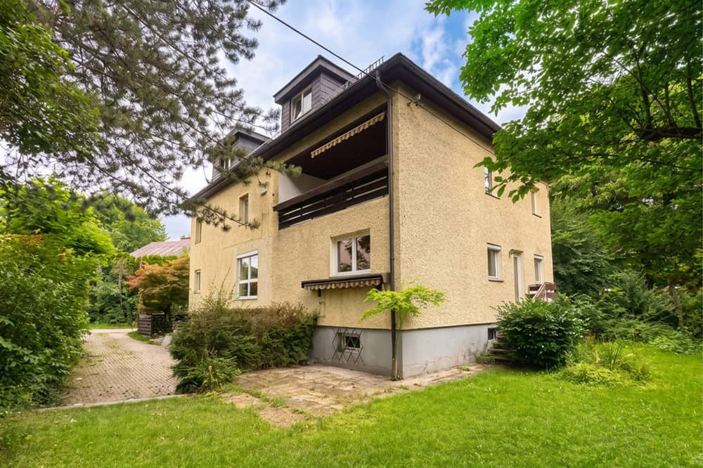 Multi family house with three units in green surroundings