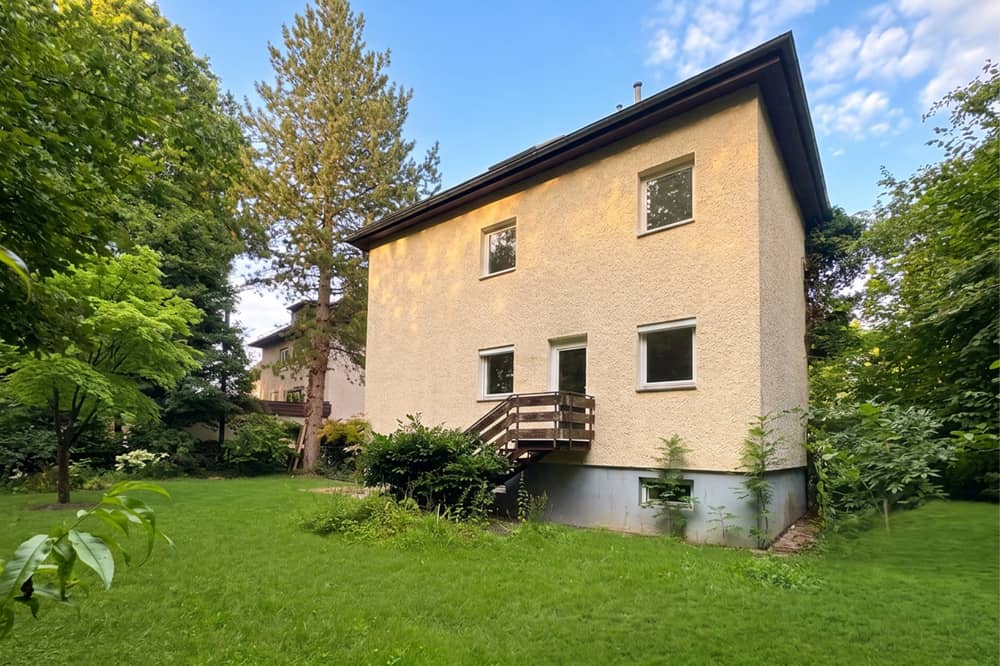 Multi family house with three units in green surroundings