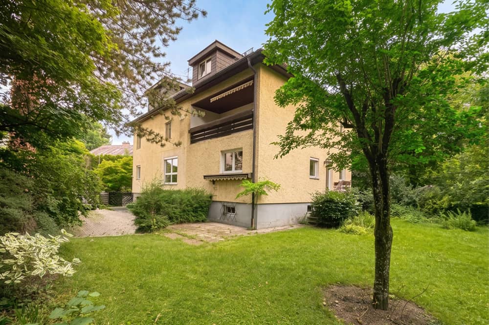 Multi family house with three units in green surroundings