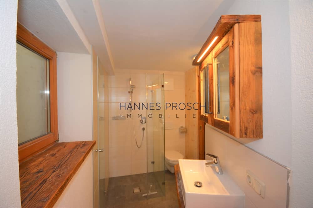 Basement apartment with open kitchen and storage in Jochberg