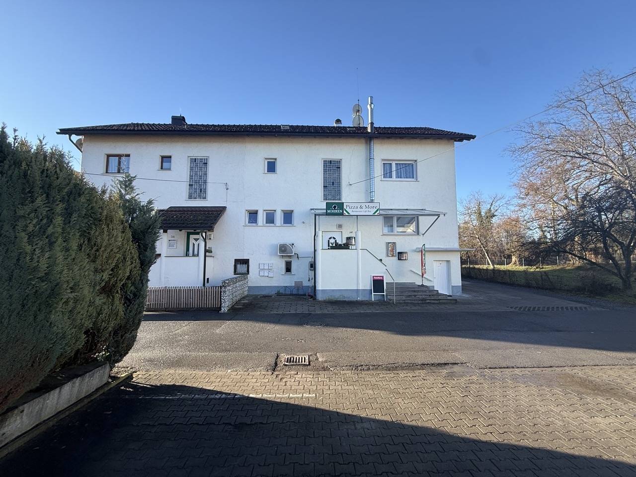 Mehrfamilienhaus mit Restaurant und Parkplatz in Bregenz