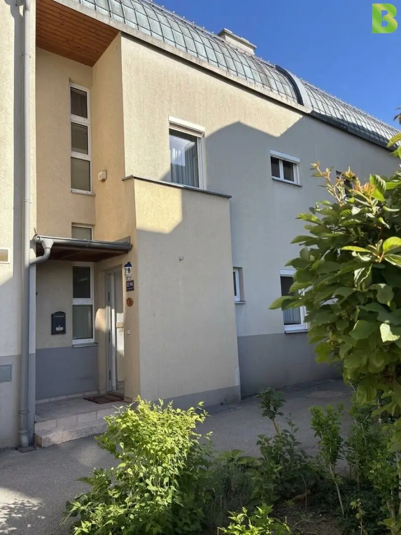 Row house with garden and tiled stove in quiet location