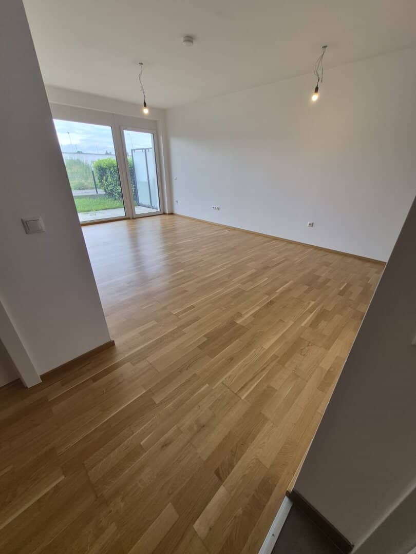 Neubauwohnung mit Garten und Terrasse
