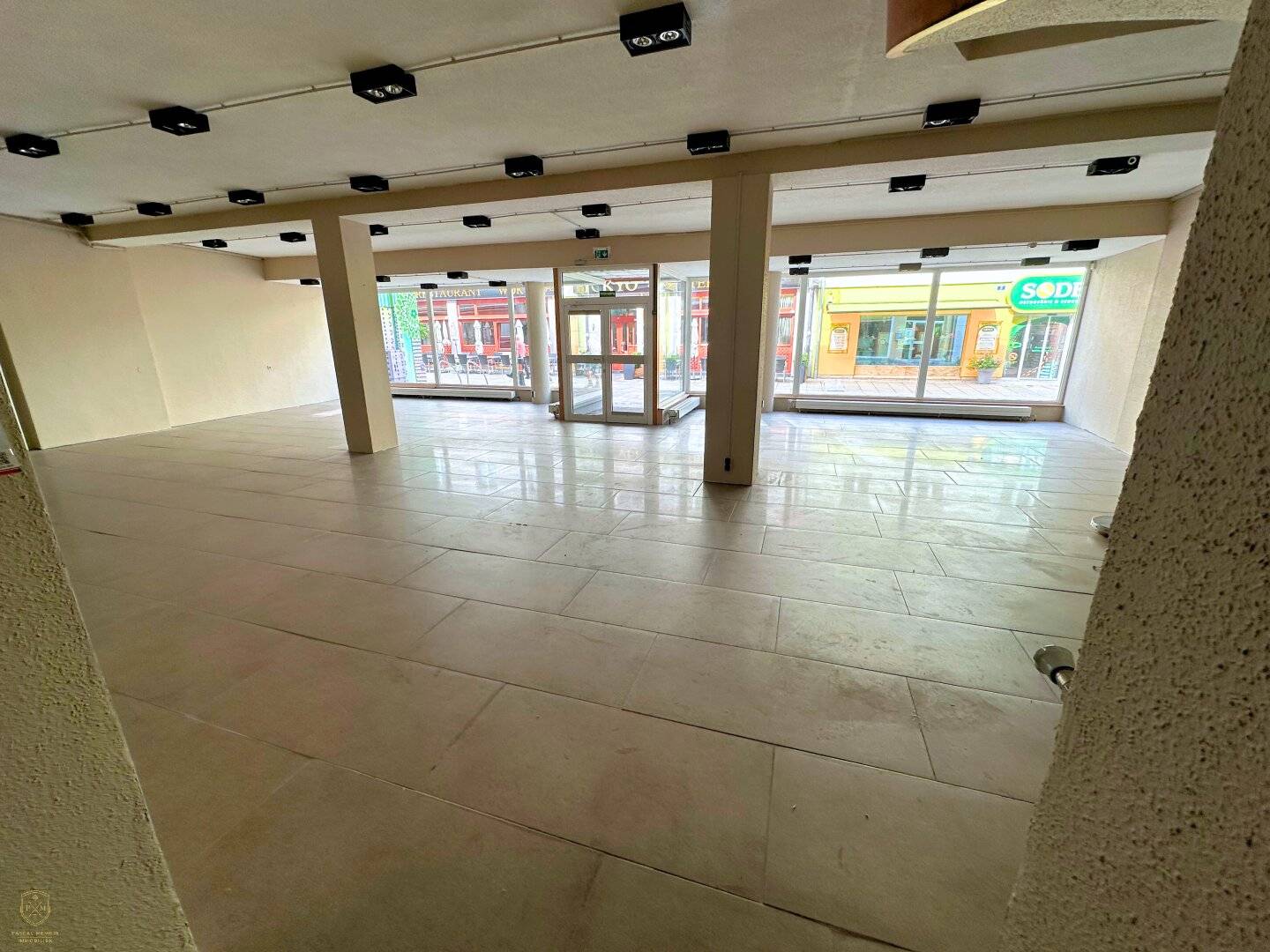 Bright commercial space with display fronts near town hall square