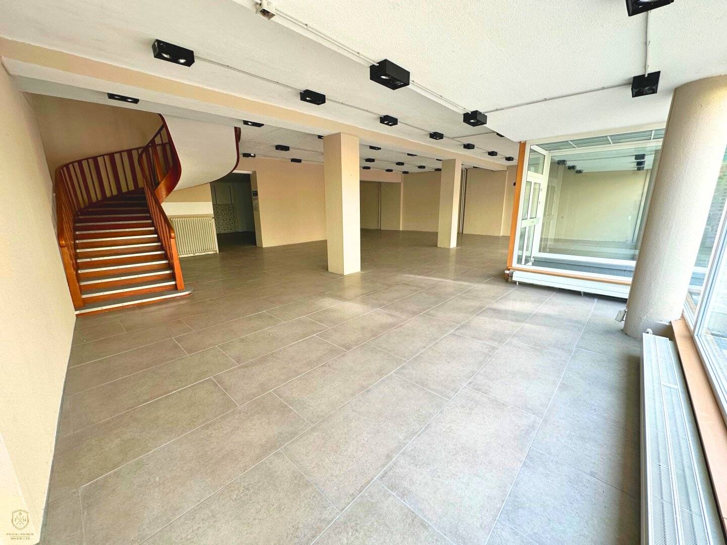 Bright commercial space with display fronts near town hall square