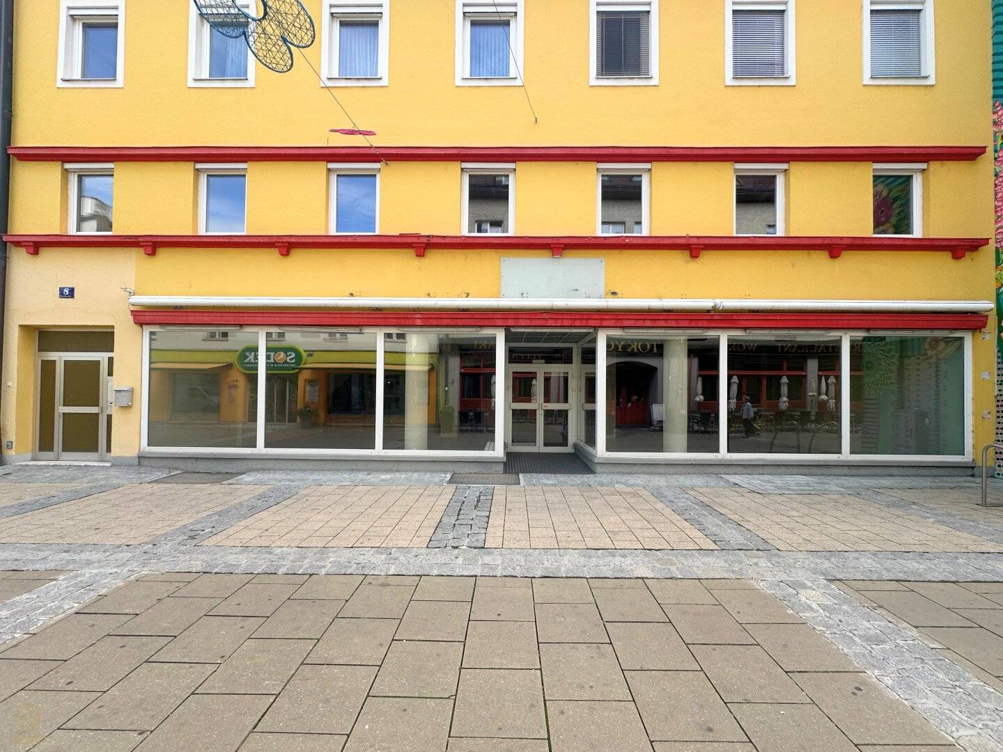 Bright commercial space with display fronts near town hall square