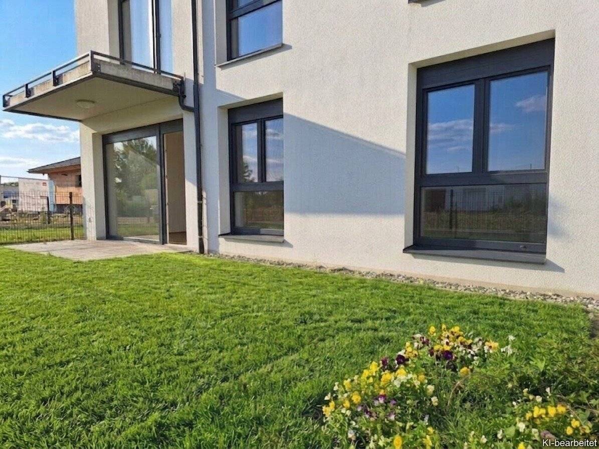 Neubauwohnung mit Garten und Terrasse