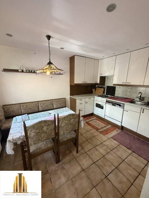 Well maintained single family home with garage and garden plot