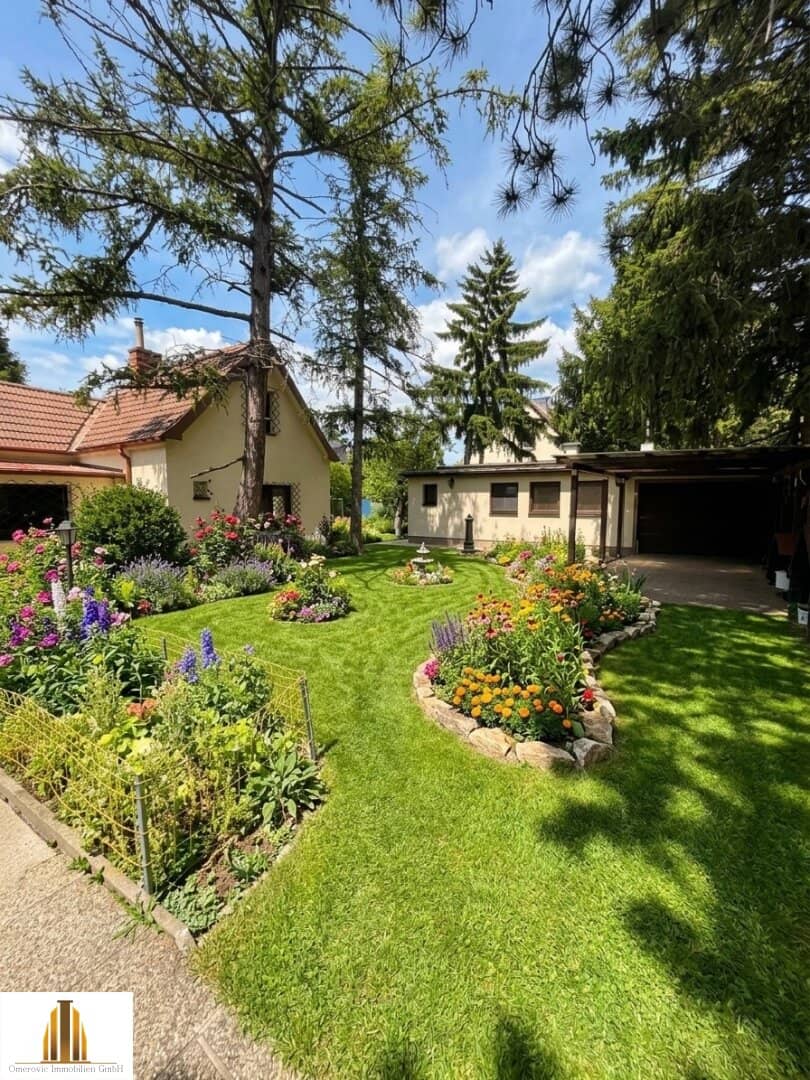 Well maintained single family home with garage and garden plot