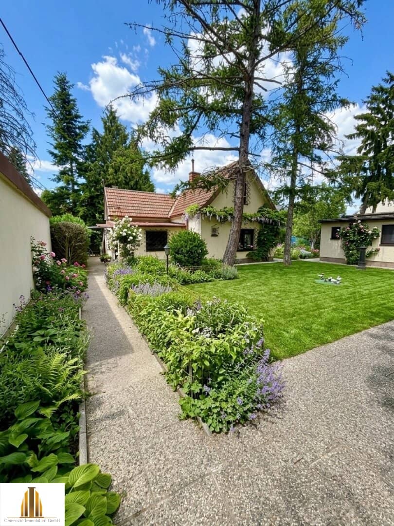Well maintained single family home with garage and garden plot