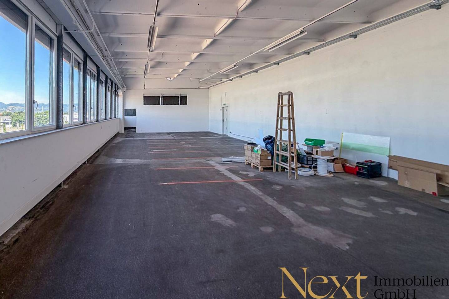 Spacious warehouse with freight elevator and parking spaces