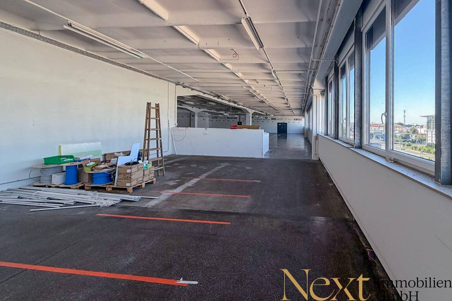 Spacious warehouse with freight elevator and parking spaces