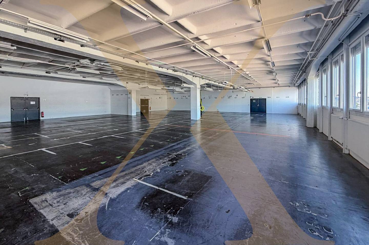 Spacious warehouse with freight elevator and parking spaces