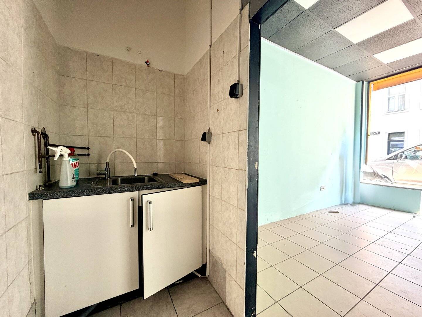Small commercial space with large storefront windows in a good location