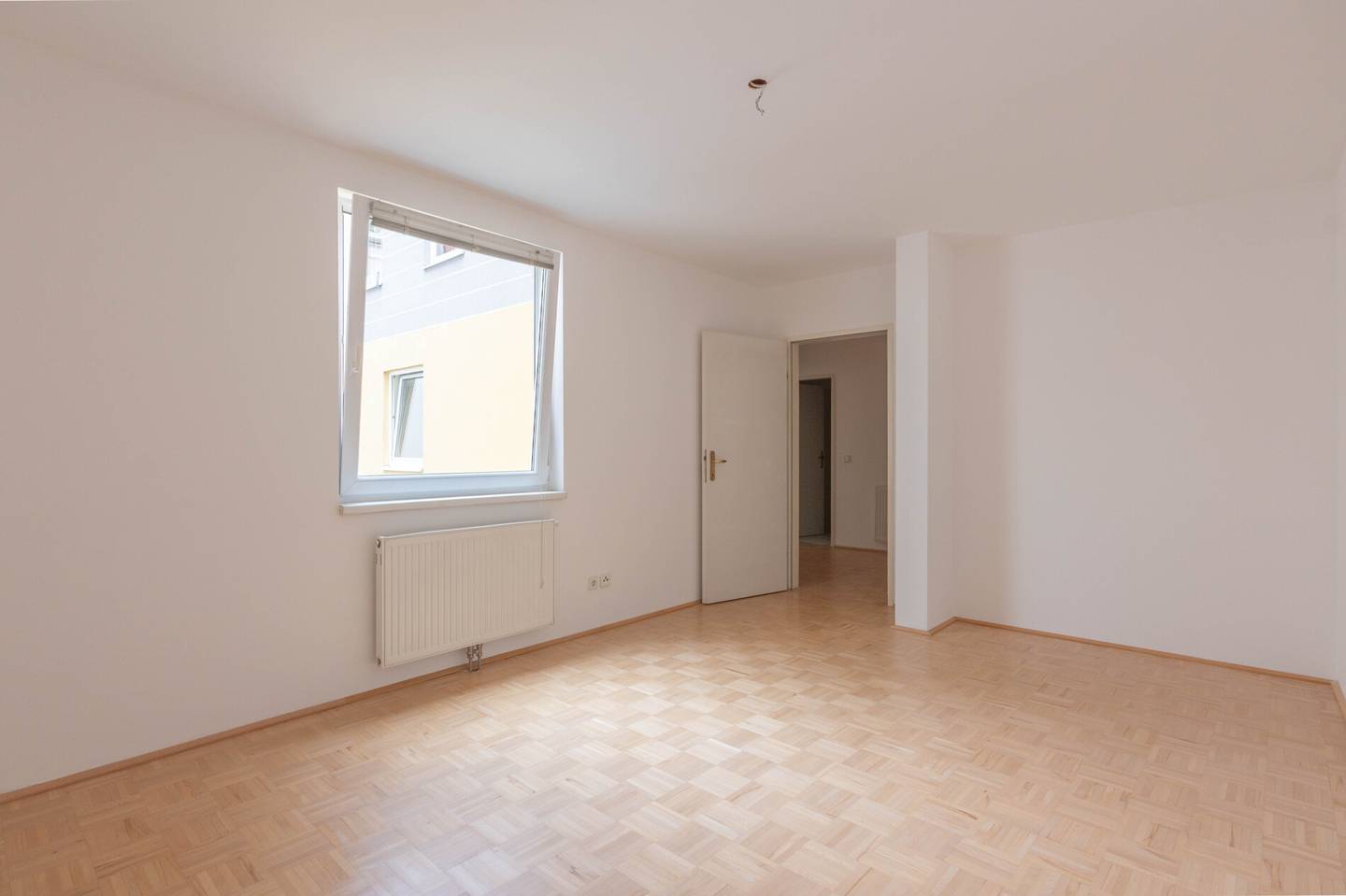 Quiet courtyard apartment with balcony view in elevator building