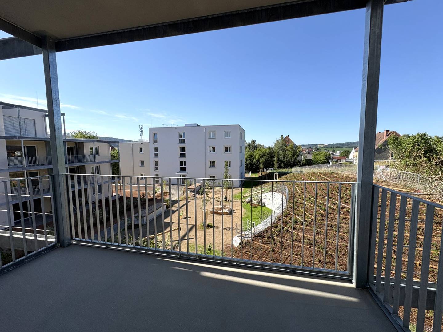 Sunny apartment with balcony and courtyard view