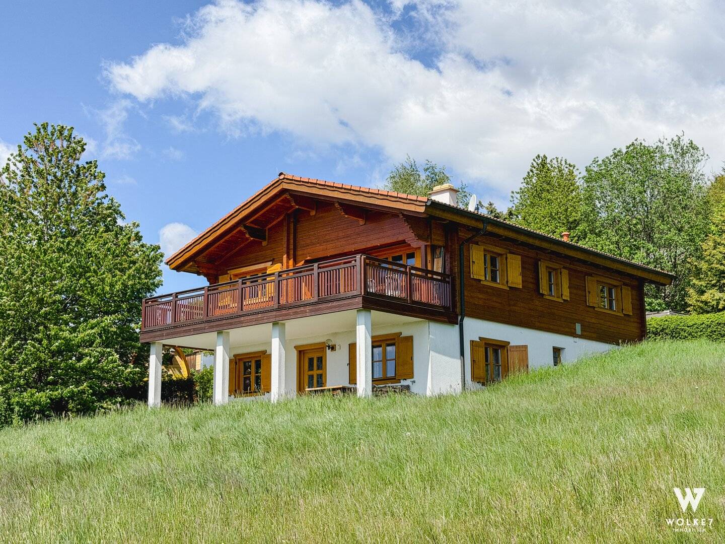 Modern wooden house with balcony and distant view