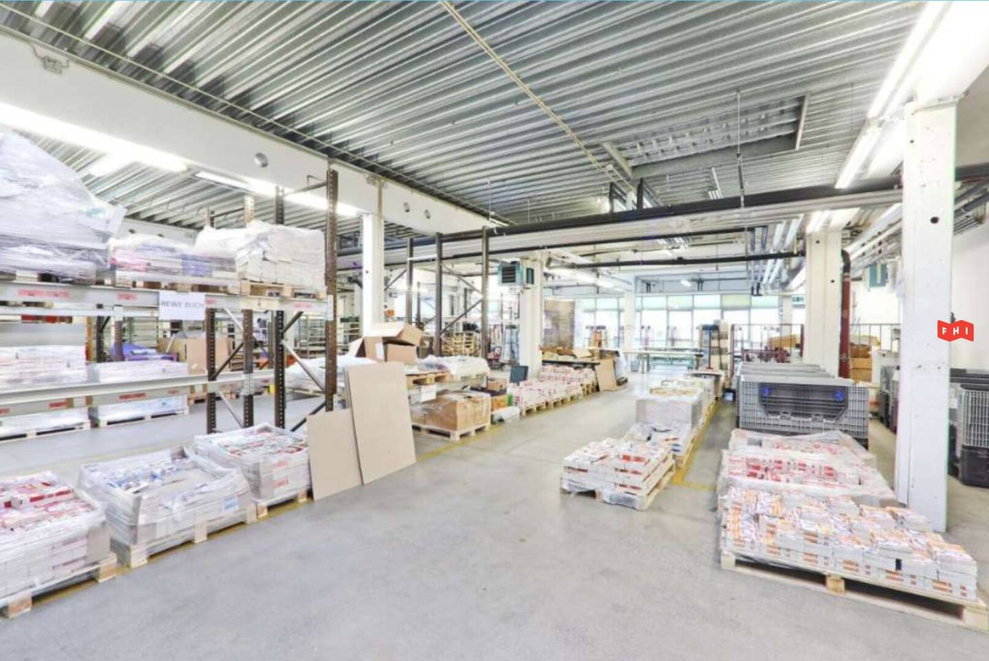 Modern commercial property with office and warehouse space and a historic building