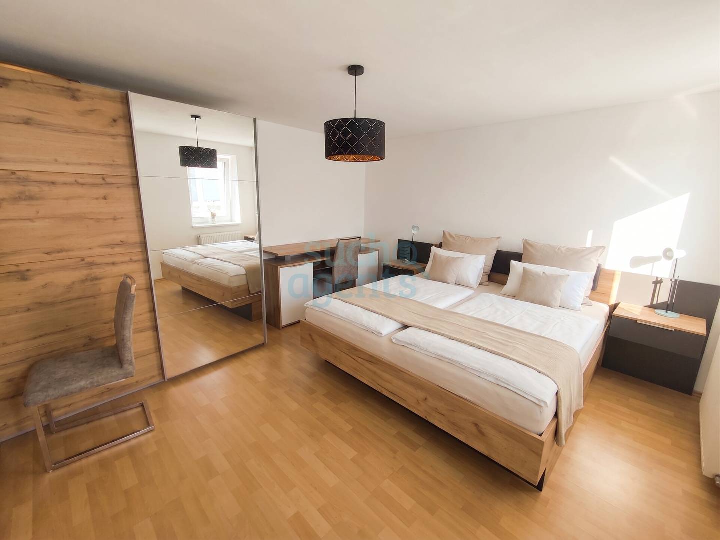 Renovated ground floor apartment with garden share and parking space