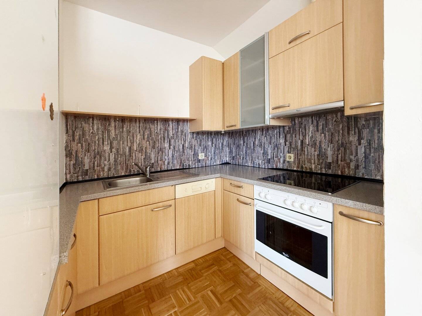 Bright attic apartment with open kitchen and storage room