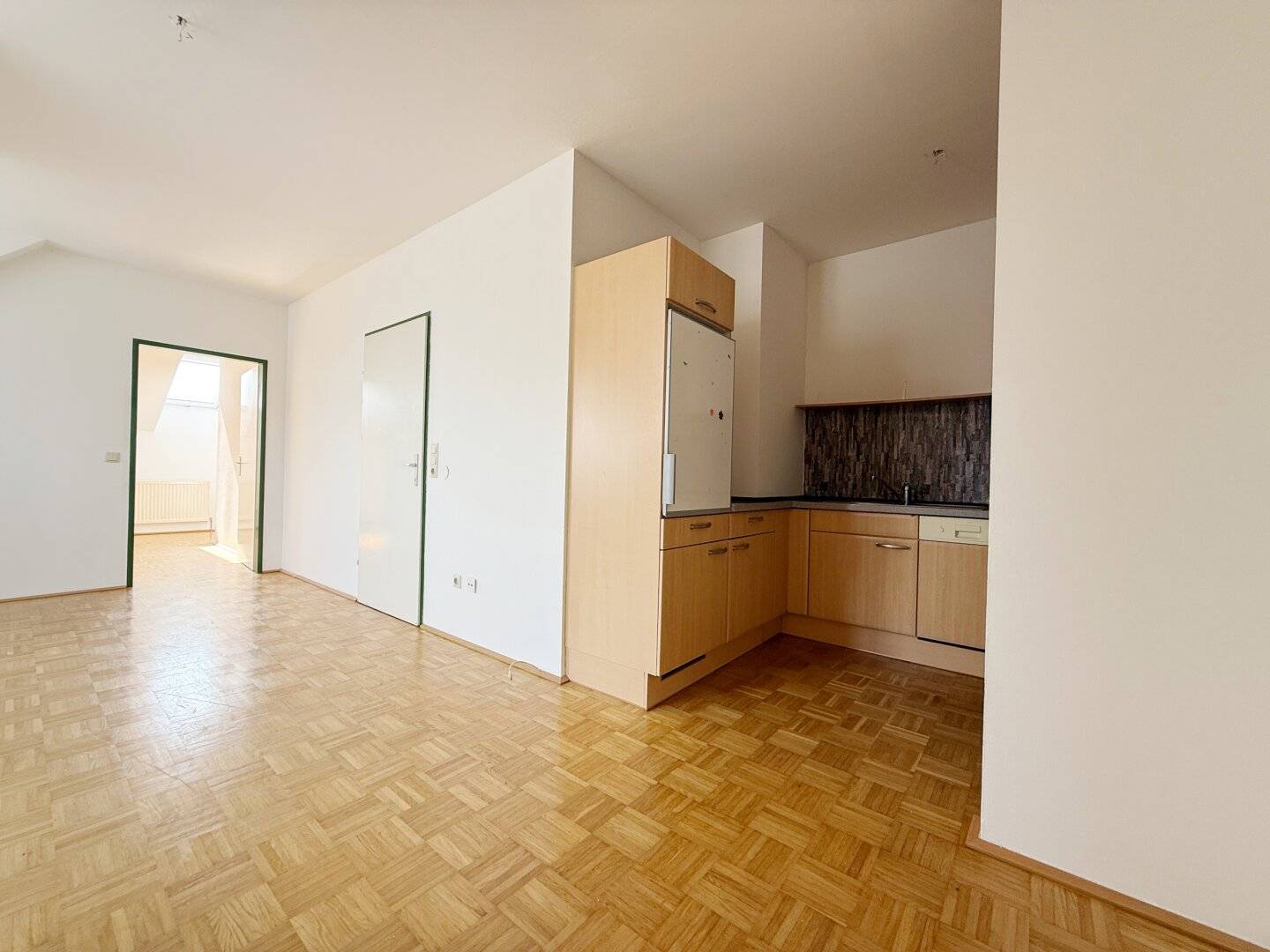 Bright attic apartment with open kitchen and storage room
