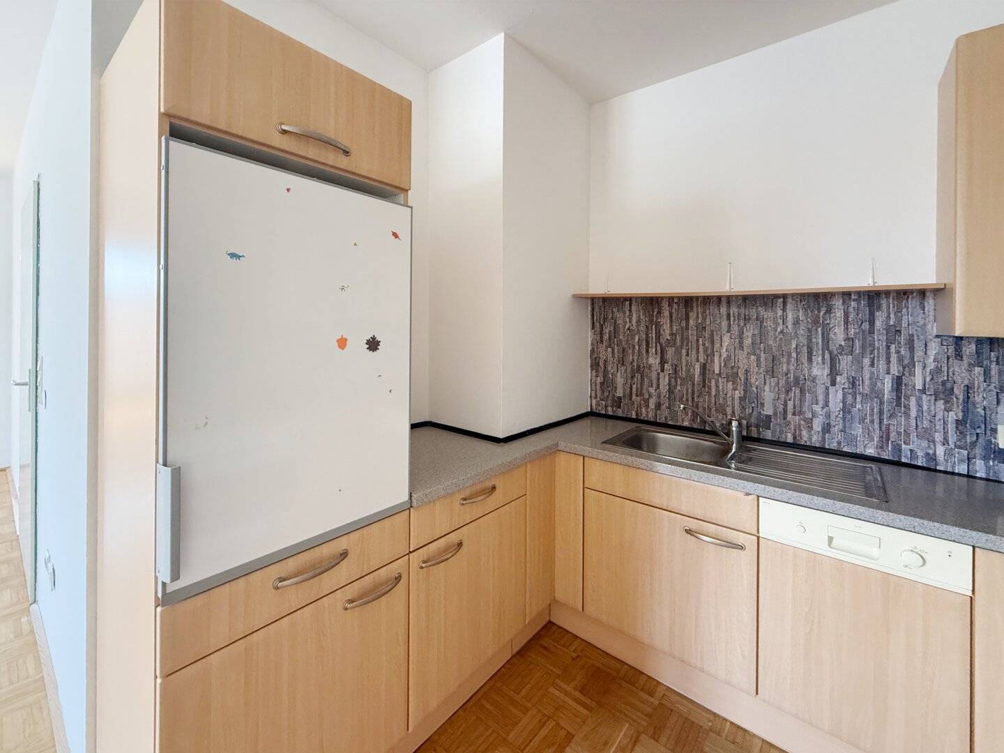 Bright attic apartment with open kitchen and storage room
