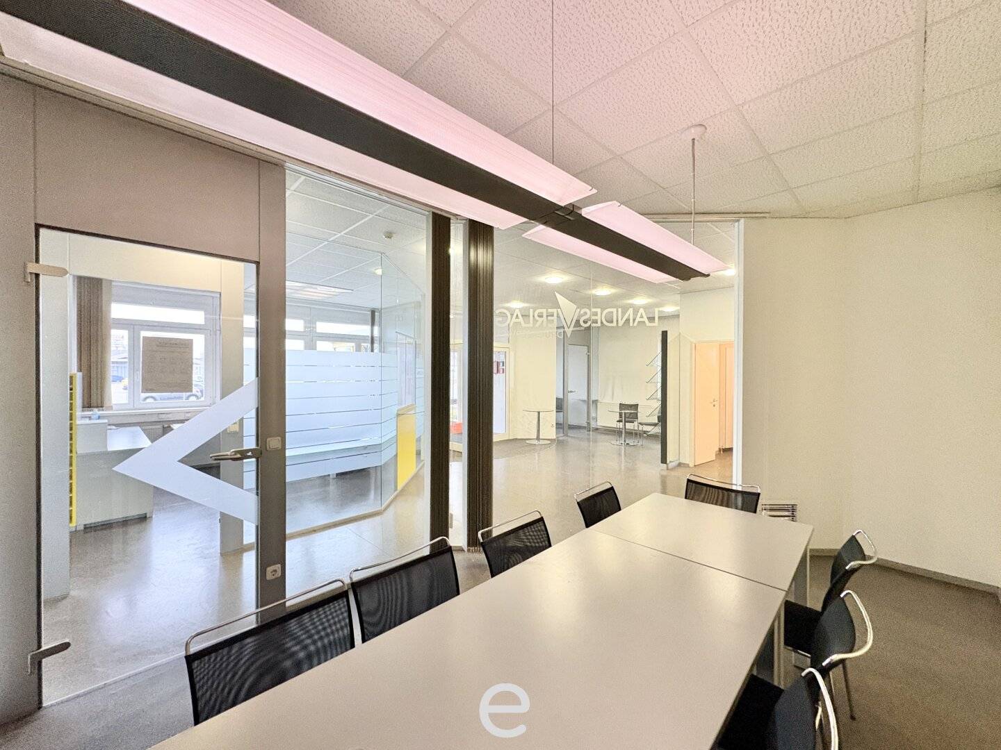 Warehouse with loading ramps and modern office space in industrial area