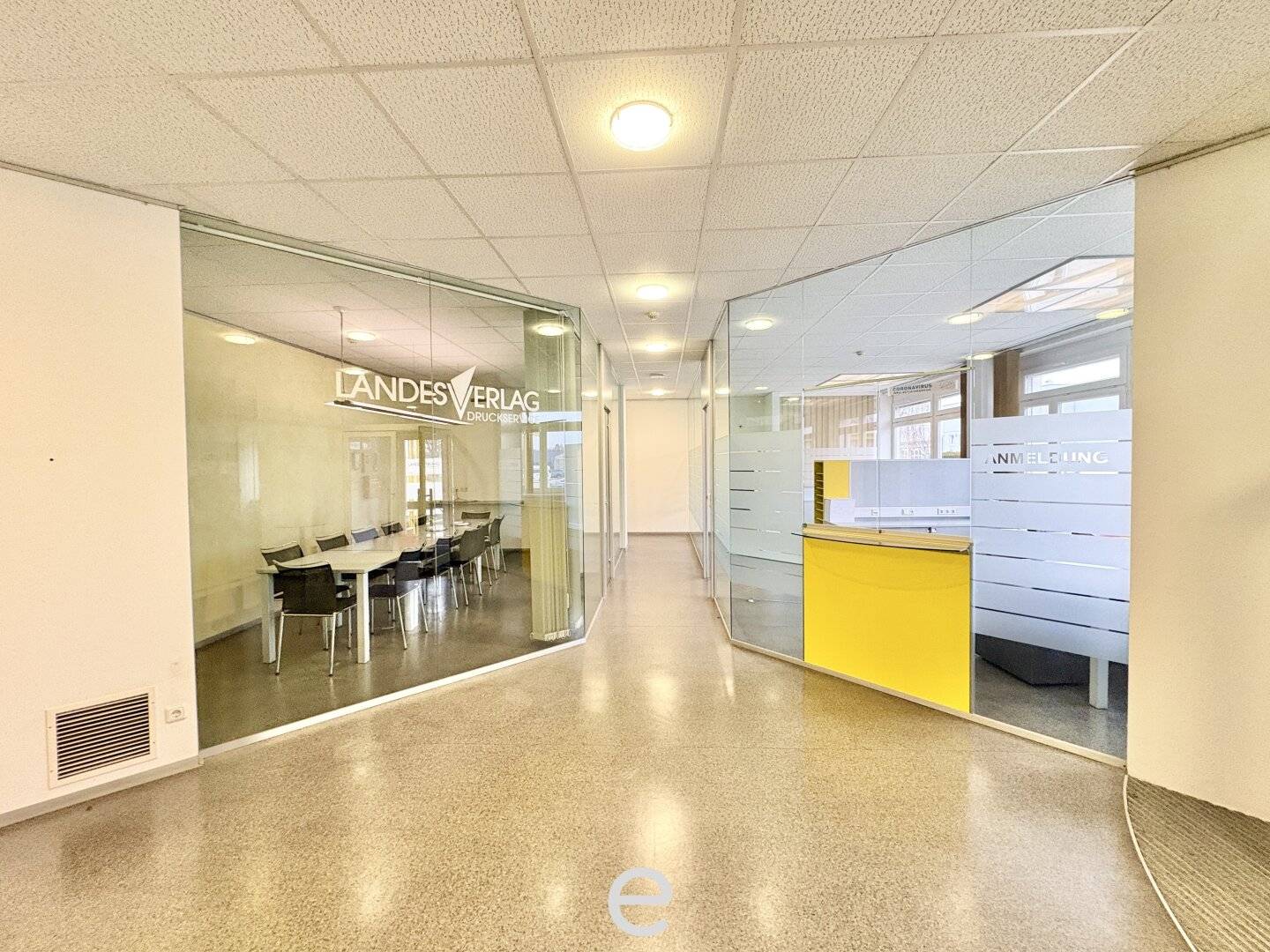 Warehouse with loading ramps and modern office space in industrial area