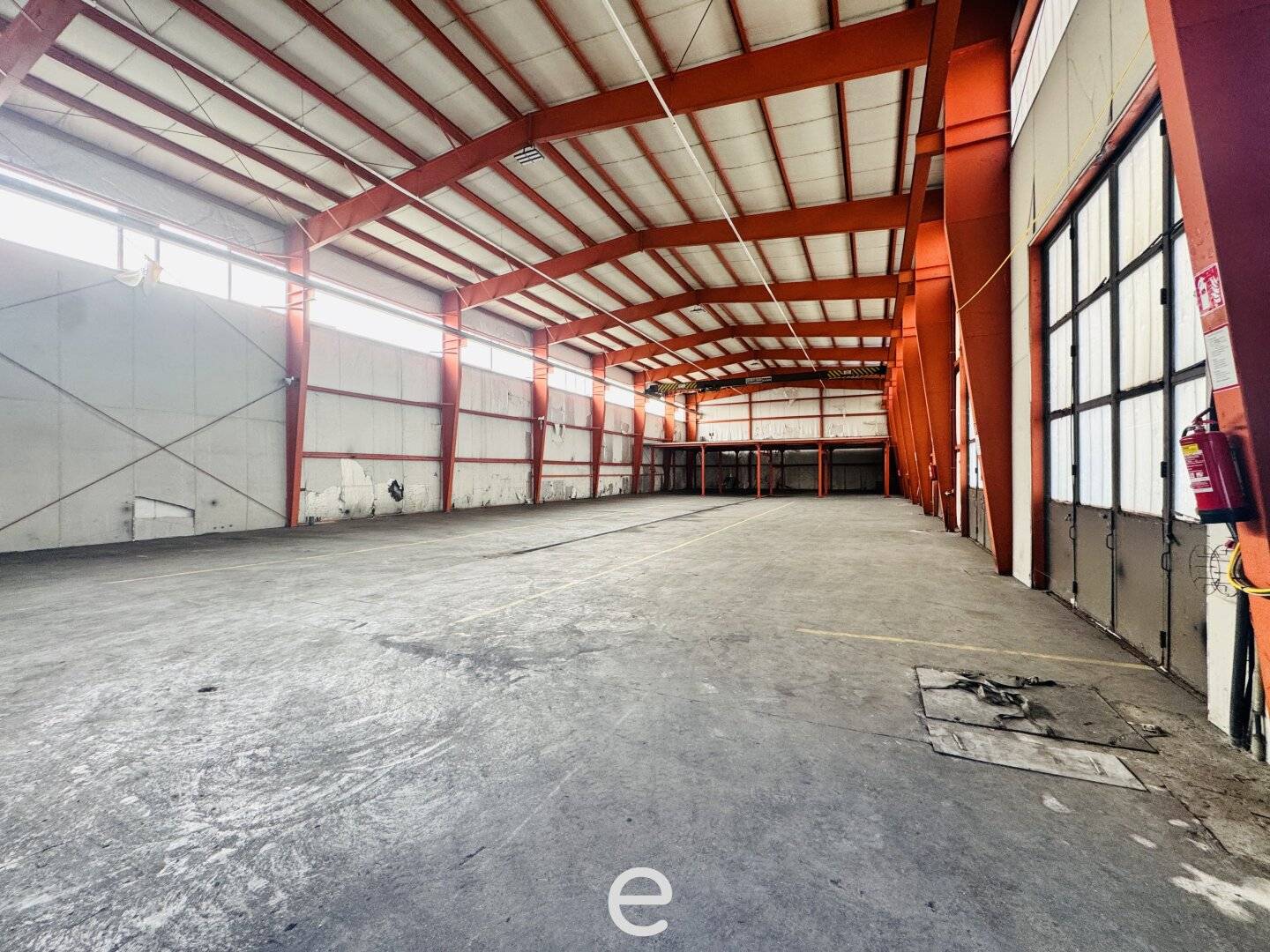 Warehouse hall with overhead crane and roller doors in Schlatt