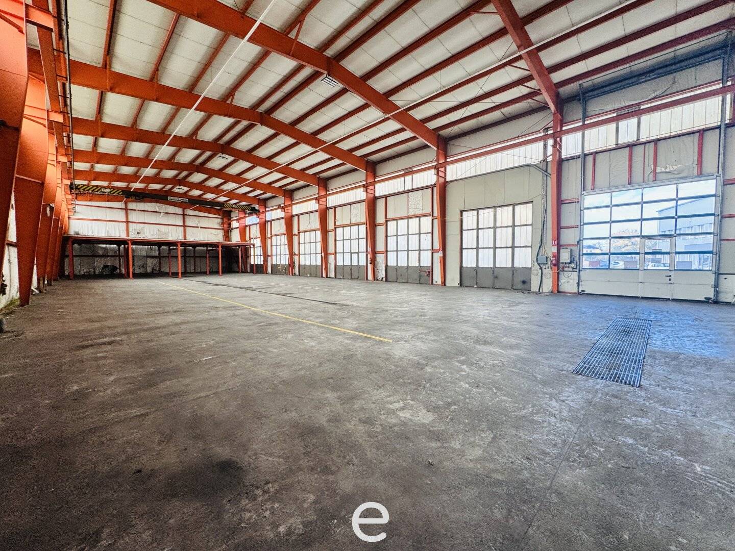 Warehouse hall with overhead crane and roller doors in Schlatt