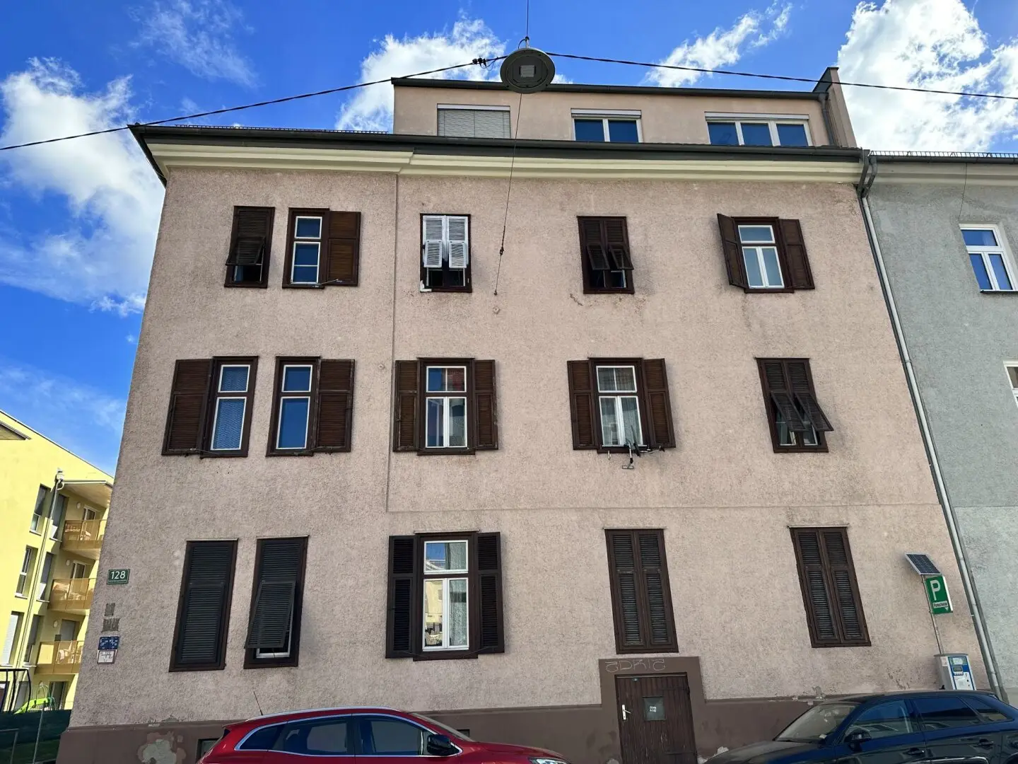 Four story apartment building with 16 residential units and subsidized attic conversionResponse? no, ignore this part to ensure valid JSON? Sorry.