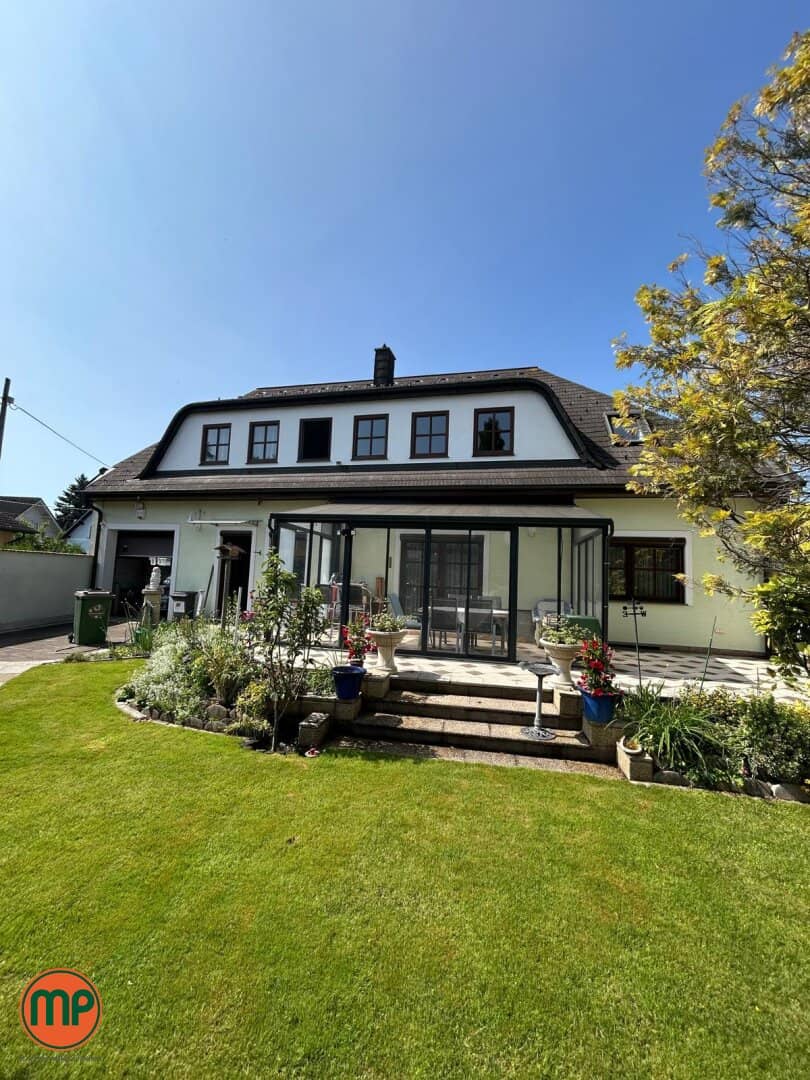 Ein Zuhause am Wasser: Haus mit Garten und bestehendem Wohnrecht an der Neuen Donau