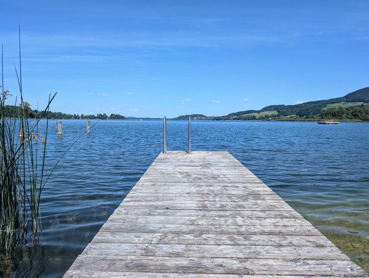 Sea residence in prime location on the Obertrumer See: generous first occupancy terrace apartment with its own bath house and jetty