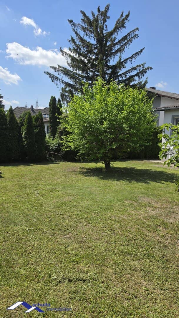 SCHULTZ IMMOBILIEN - Modern single-family house with conservatory and dreamlike garden in a quiet location in Wiener Neudorf