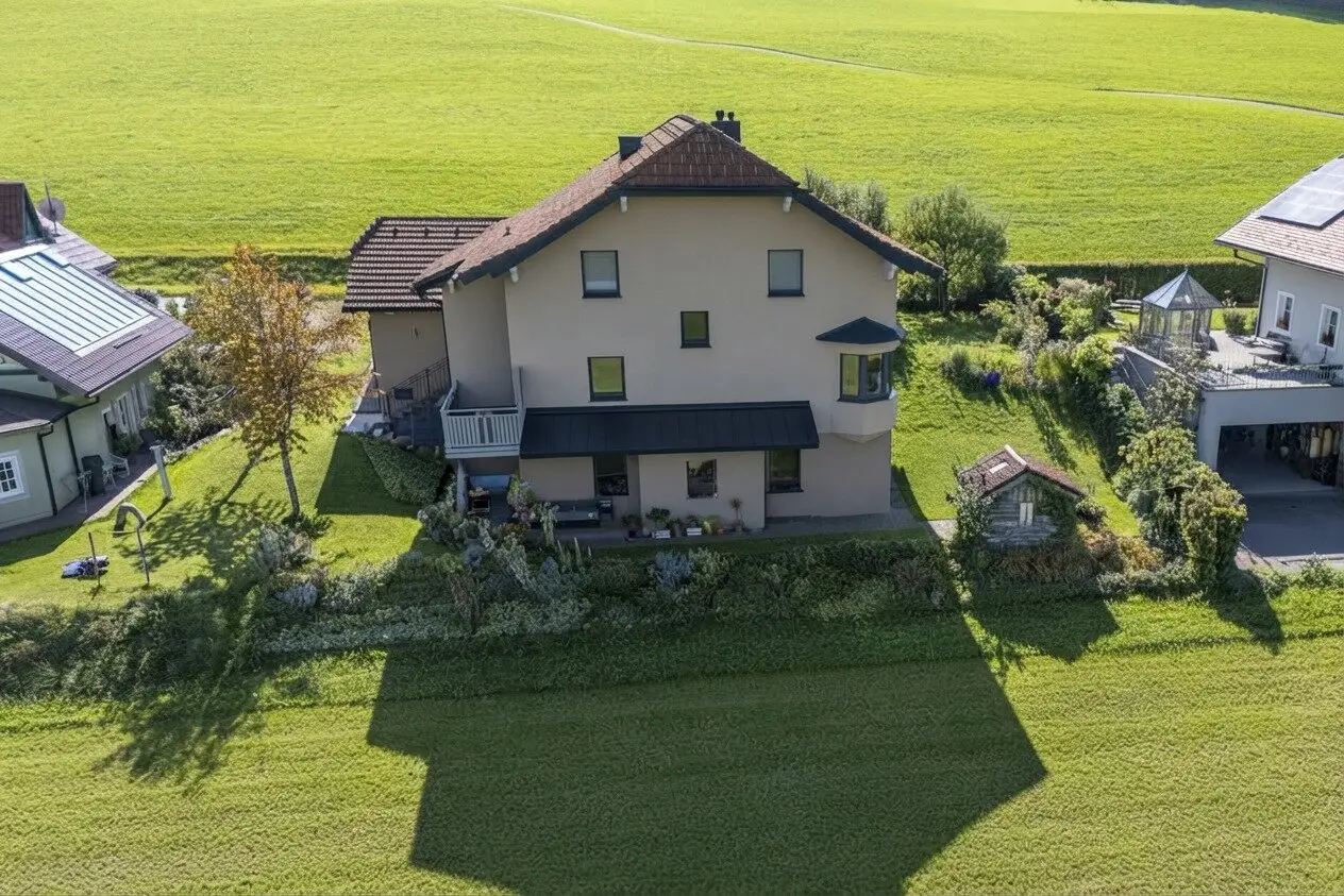 Top two family house in Koppl near Salzburg with a granny flat, two balconies, a garage, solar system and living space ventilation