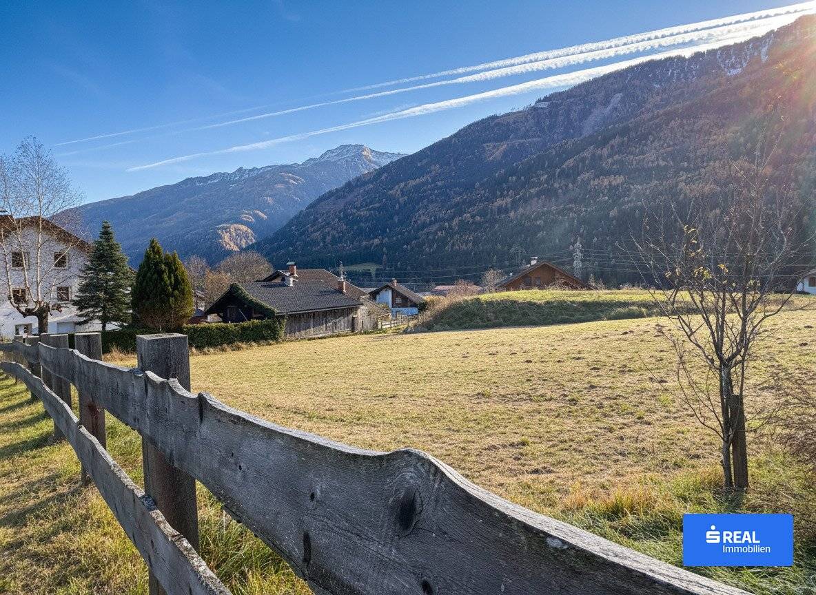 Behind the blue of the mountains