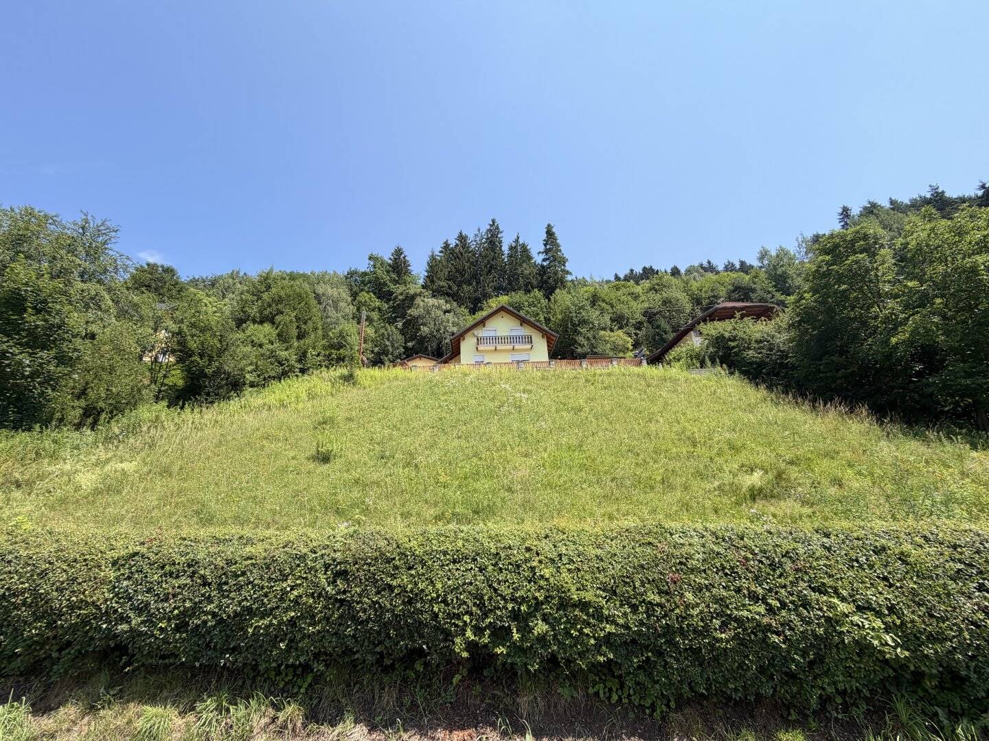 Sunny building plot in hillside location with unobstructed view