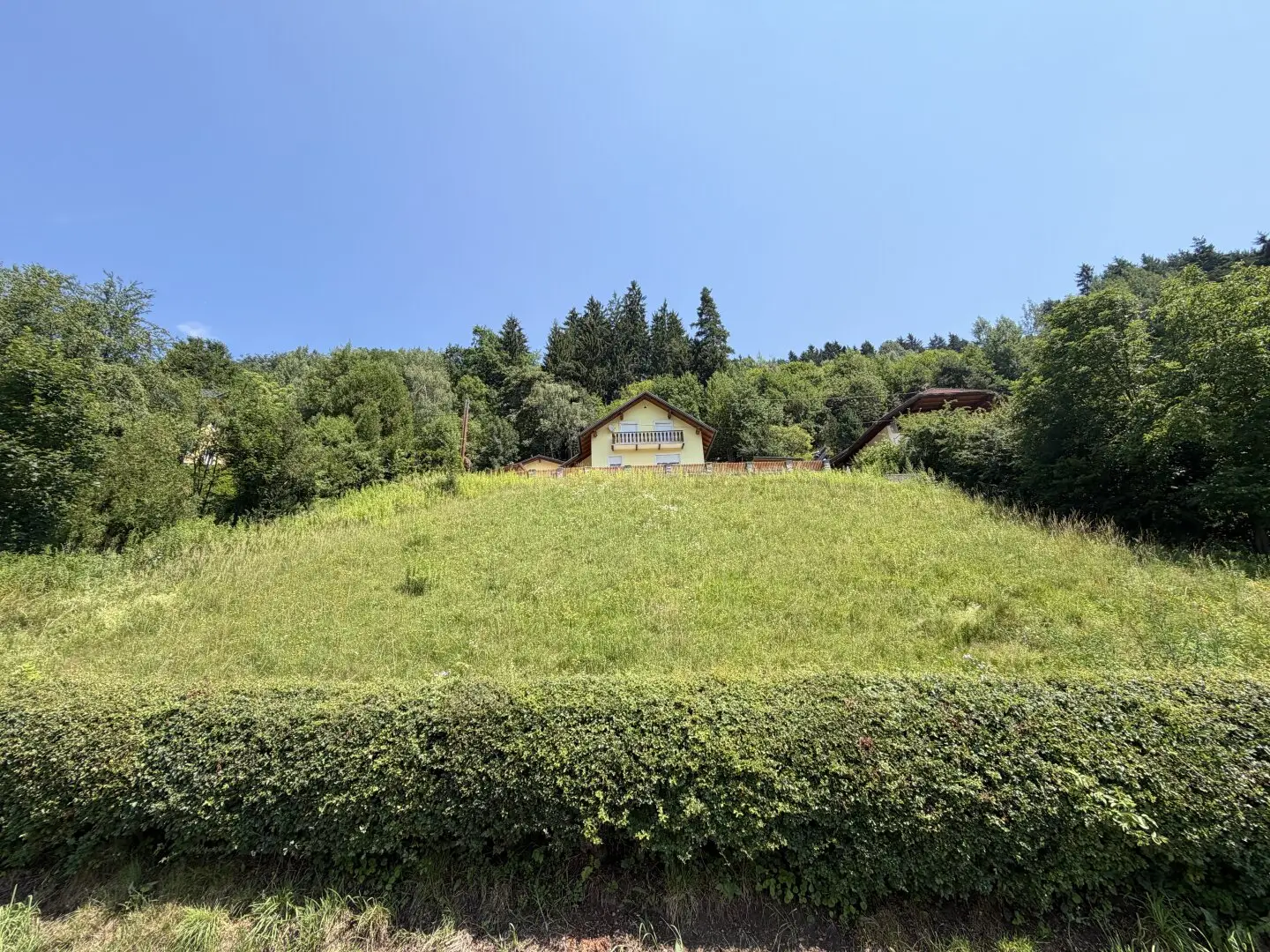 Sunny building plot in hillside location with unobstructed view