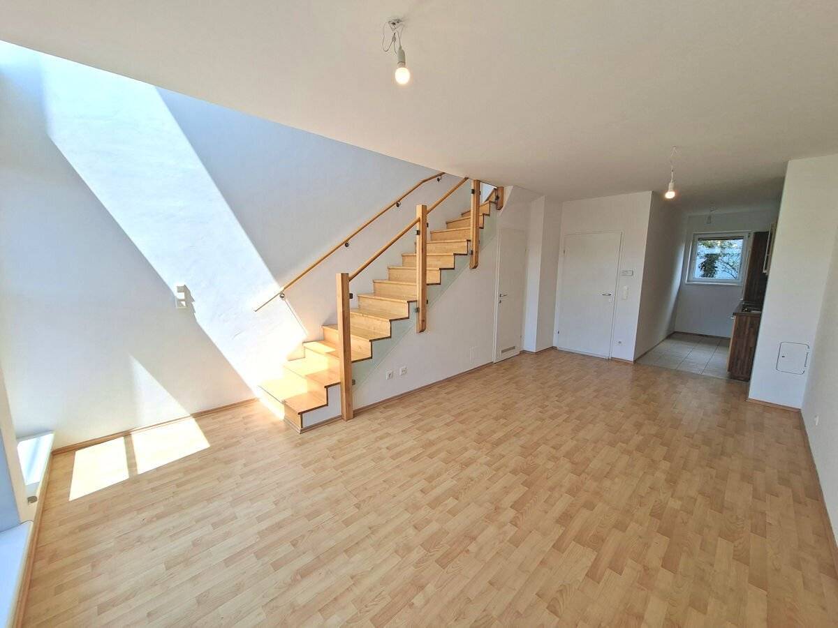 Maisonette apartment in the style of a terraced house with private garden, terrace and balcony plus access to a bathing pond