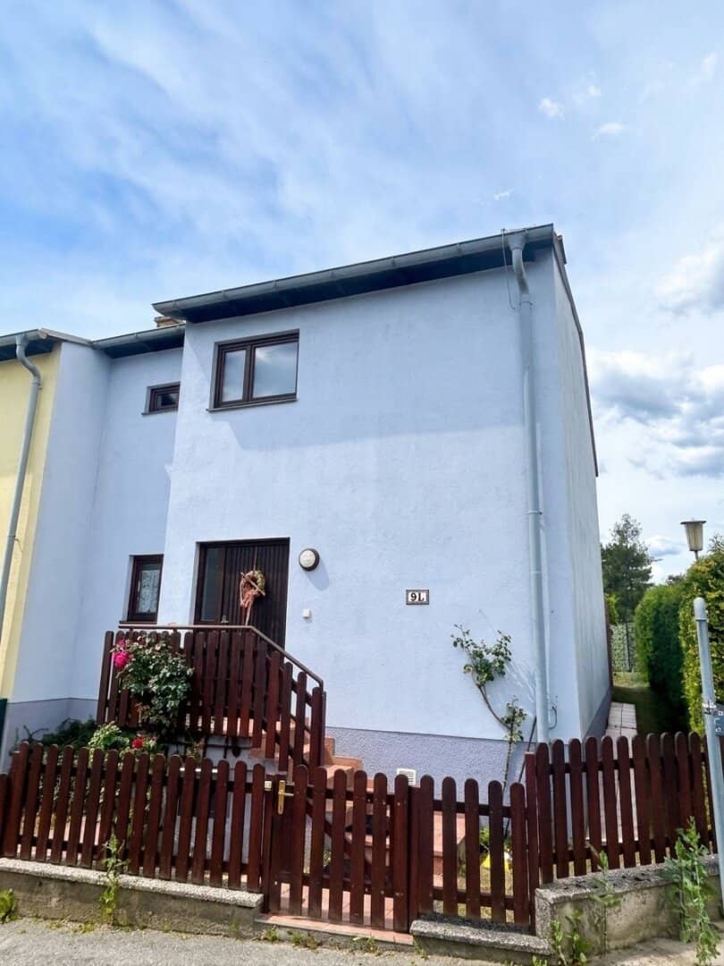 Charming corner terraced house with distant view of the greenery, garden, garage and parking space in Pottschach