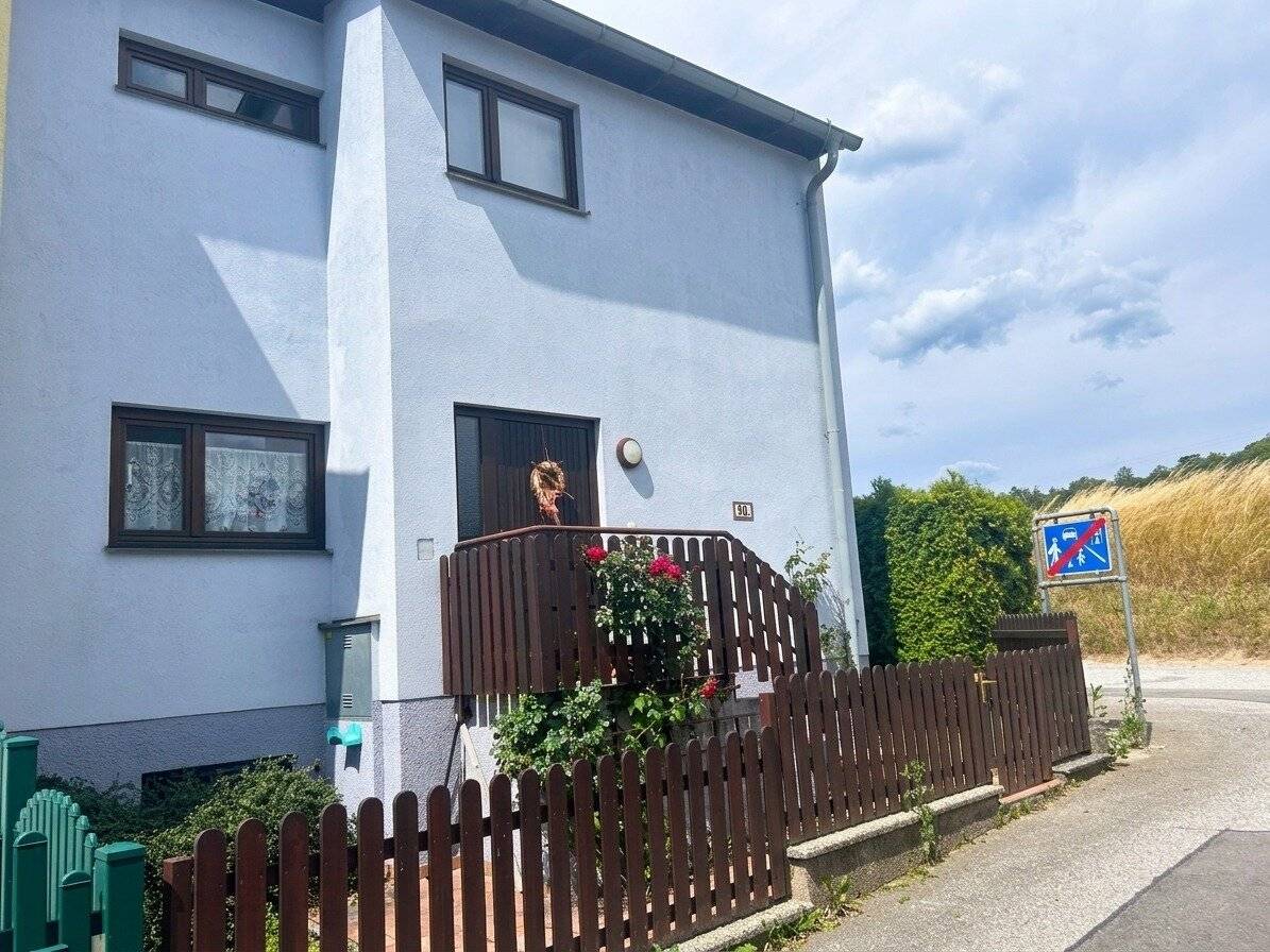 Charming corner terraced house with distant view of the greenery, garden, garage and parking space in Pottschach